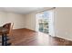 Spacious living room area with a patio door, bar stool seating, and ample natural light at 1620 #G Arlyn Cir # G, Charlotte, NC 28213