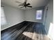 Spacious bedroom with ceiling fan and dark laminate flooring at 1704 Fieldcrest Cir, Rock Hill, SC 29732