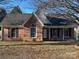 Brick ranch home with a landscaped yard and attached garage at 1704 Fieldcrest Cir, Rock Hill, SC 29732