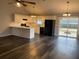 Open concept kitchen with island, white cabinets, and dark floors at 1704 Fieldcrest Cir, Rock Hill, SC 29732