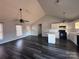 Spacious living room with high ceilings, dark floors, and kitchen access at 1704 Fieldcrest Cir, Rock Hill, SC 29732