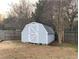 Exterior shed with gray painted siding and single door at 1704 Fieldcrest Cir, Rock Hill, SC 29732