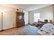 Simple bedroom with wood furniture and neutral colored walls at 1957 Beth Haven Church Rd, Denver, NC 28037