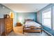 Light and airy bedroom with double windows and wood furniture at 1957 Beth Haven Church Rd, Denver, NC 28037