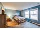 Serene bedroom with wooden bed frame and ample natural light at 1957 Beth Haven Church Rd, Denver, NC 28037