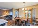 Bright dining area adjacent to living room with charming wooden furniture at 1957 Beth Haven Church Rd, Denver, NC 28037