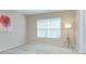 Simple bedroom with large window and floor lamp at 206 River Clay Rd, Fort Mill, SC 29708