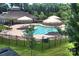 Community pool with multiple umbrellas and seating at 206 River Clay Rd, Fort Mill, SC 29708