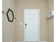 Simple entryway with white door, mirror, and shelves at 206 River Clay Rd, Fort Mill, SC 29708