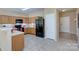 Modern kitchen with wood cabinets and black appliances at 206 River Clay Rd, Fort Mill, SC 29708