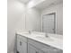 Double vanity bathroom with modern finishes at 221 Wildflower Dr, Locust, NC 28097