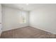 Bright bedroom with neutral carpeting and large window at 221 Wildflower Dr, Locust, NC 28097