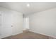 Simple bedroom with carpet, neutral walls and multiple doors at 221 Wildflower Dr, Locust, NC 28097