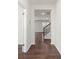 Hardwood floor hallway leading to staircase and living area at 221 Wildflower Dr, Locust, NC 28097