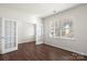 Home office featuring hardwood floors and French doors at 221 Wildflower Dr, Locust, NC 28097