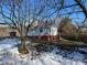 Snowy backyard with trees and house in background at 2244 9Th Ne Ave, Hickory, NC 28601