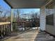 Wooden deck with railing overlooking a snowy backyard at 2244 9Th Ne Ave, Hickory, NC 28601