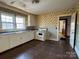 Kitchen features white cabinets and linoleum floor at 2244 9Th Ne Ave, Hickory, NC 28601