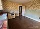 Kitchen with vintage stove and floral wallpaper at 2244 9Th Ne Ave, Hickory, NC 28601