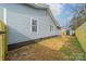 Gray house with fenced backyard and storage shed at 2328 Sanders Ave, Charlotte, NC 28216