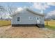 Gray house with fenced backyard and storage shed at 2328 Sanders Ave, Charlotte, NC 28216