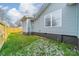 Side yard view, gray siding and fence at 2328 Sanders Ave, Charlotte, NC 28216