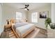 Spacious main bedroom featuring a light wood platform bed and plenty of natural light at 2328 Sanders Ave, Charlotte, NC 28216