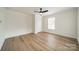 Spacious bedroom with hardwood floors and a window at 2328 Sanders Ave, Charlotte, NC 28216