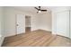 Bedroom with hardwood floors, a closet, and access to another room at 2328 Sanders Ave, Charlotte, NC 28216