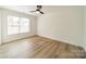 Bright bedroom with hardwood floors and a ceiling fan at 2328 Sanders Ave, Charlotte, NC 28216