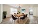 Modern dining room with hardwood floors and a view of the kitchen at 2328 Sanders Ave, Charlotte, NC 28216