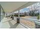 Inviting front porch with white railings and view of the front yard at 2328 Sanders Ave, Charlotte, NC 28216