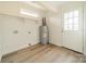 Laundry room with vinyl flooring, shelving, and exterior access at 2328 Sanders Ave, Charlotte, NC 28216