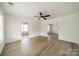 Open living space featuring hardwood floors and views into adjacent rooms at 2328 Sanders Ave, Charlotte, NC 28216