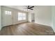 Living room with hardwood floors and access to other rooms at 2328 Sanders Ave, Charlotte, NC 28216