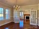 Bright dining room with hardwood floors and French doors leading to the living room at 300 S Thompson St, Shelby, NC 28150