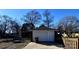 Detached brick garage with a large door at 300 S Thompson St, Shelby, NC 28150