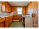 Small kitchen with wood cabinets and appliances at 304 Edel St, Kings Mountain, NC 28086