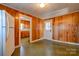 Kitchen area with wood cabinets and a door at 304 Edel St, Kings Mountain, NC 28086