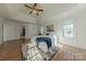 Comfortable bedroom with hardwood floors and a ceiling fan at 4225 Nathaniel Glen Ct, Matthews, NC 28105