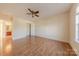 Bright bedroom with hardwood floors and ceiling fan at 4225 Nathaniel Glen Ct, Matthews, NC 28105