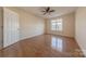 Spacious bedroom with hardwood floors and ceiling fan at 4225 Nathaniel Glen Ct, Matthews, NC 28105