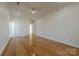 Bright bedroom featuring hardwood floors and neutral walls at 4225 Nathaniel Glen Ct, Matthews, NC 28105