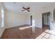 Sunny bedroom with hardwood floors and ceiling fan at 4225 Nathaniel Glen Ct, Matthews, NC 28105