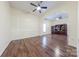 Bright bedroom featuring hardwood floors and built-in shelving at 4225 Nathaniel Glen Ct, Matthews, NC 28105