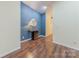 Elegant hallway with blue patterned wall and hardwood floors at 4225 Nathaniel Glen Ct, Matthews, NC 28105