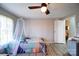 Bright bedroom with ceiling fan and plenty of natural light at 427 Twin Oaks Rd, Statesville, NC 28625