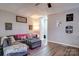 Cozy living room with L-shaped sofa and wood-look floors at 427 Twin Oaks Rd, Statesville, NC 28625