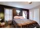 Main bedroom with brown bedding and modern decor at 427 Twin Oaks Rd, Statesville, NC 28625