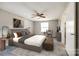 Bright bedroom showcasing a comfortable bed, stylish decor, and a ceiling fan at 4901 Smokehollow Rd, Charlotte, NC 28227